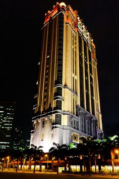 a very tall building lit up at night