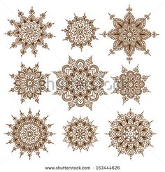 a set of brown and white circular floral ornaments ornament designs on a white background