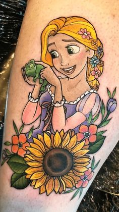 a tattoo with a girl holding a frog on it's arm and sunflowers in the background