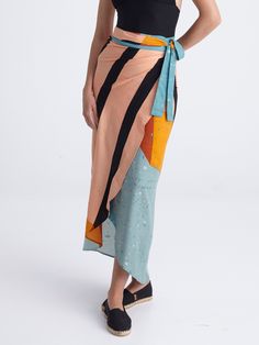 Meet our wrap skirt inspiration that fits and suits many different body types! You can wrap it around your waist, or below it, and tie it in a nice bow in your front side. Its belt parts are doubled in order to be more solid, and the circular bottom part of the skirt is light and floating. Its length makes it easy to be worn barefoot or with a pair of flip flops and can also be worn as a dress, if you tie it above your chest. This design can perfectly be worn off the beach as well, since it cons Beach Wrap Skirt, Wave Dance, Skirt Bow, Skirt Beach, Skirt Inspiration, Colorful Crop Tops, Beach Wrap, Print Inspiration, Short Jumpsuit