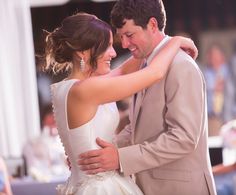 a bride and groom dance together at their wedding reception