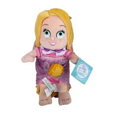 a stuffed doll with blue eyes and blonde hair holding a small yellow object in its hand