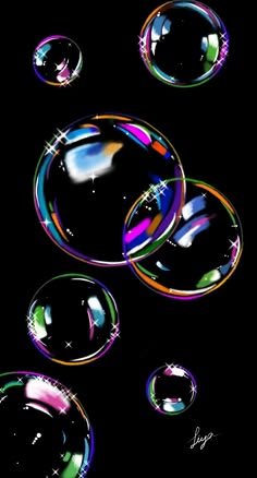 soap bubbles floating in the air on a black background