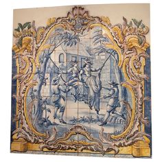 an ornate tile wall with blue and yellow designs on it's sides, depicting two men riding horses