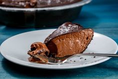 a piece of chocolate pie on a plate with a fork