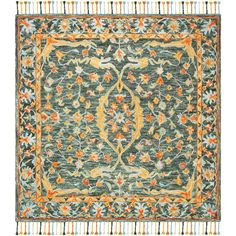 a green rug with an orange and blue design on the center, surrounded by fringes