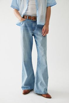 Throwback-style bell bottom jeans in 14oz. BDG denim. Relaxed fit jeans with a slouchy loose leg and wide leg openings. Only at Urban Outfitters. Features BDG Slacker relaxed fit denim jeans Bell bottom jeans by BDG Mid rise waist 14 oz. denim 5-pocket; zip fly Slouchy & loose fit Flared legs UO exclusive Content + Care 100% Cotton Machine wash Imported Size + Fit Model in Vintage Denim Medium is 6'2" and wearing size 32 Measurements taken from size 32 Rise: 10" Inseam: 33" Leg Opening: 12.5" | Streetwear Flare Jeans, Casual Blue Flares With Five Pockets, Bottom Jeans, Blue Fits, Relaxed Fit Jeans, Bell Bottom, Denim Jean, Vintage Denim, Mens Bottom