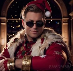 a man wearing sunglasses and a santa hat with his hands on his chest looking at the camera