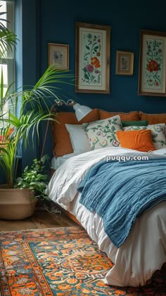 a bedroom with blue walls and orange accents