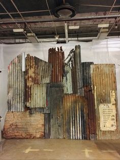 an image of old rusty metal panels on the wall in a warehouse or office setting