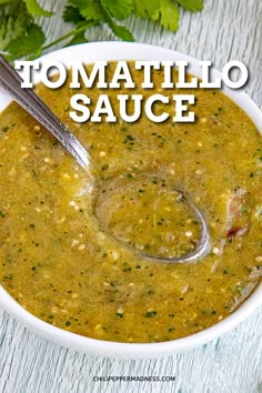 a white bowl filled with soup and garnished with cilantro