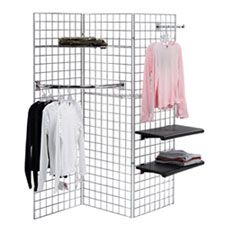 a rack with clothes hanging on it next to a wall mounted coat rack and shelf