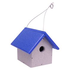 a blue birdhouse hanging from a hook