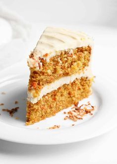 a slice of carrot cake on a white plate