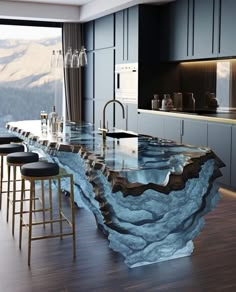 a large kitchen with an island counter top and bar stools in front of it