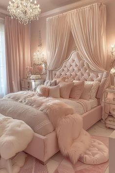 a bedroom with pink and white decor, chandelier, bedding and curtains