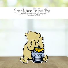 a sticker of a teddy bear sitting on top of a bucket with honey in it