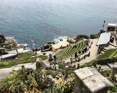 an aerial view of the ocean with people walking up and down steps to the water