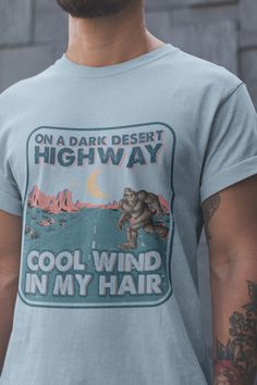 Bigfoot Shirt | On A Dark Desert Highway | Sasquatch Shirt | Cool Wind In My Hair Bigfoot | Funny Tee | Funny Bigfoot Gift | Unisex Shirt No side seams mean there are no itchy interruptions under the arms. The shoulders have tape for improved durability. .: 100% cotton (fiber content may vary for different colors) .: Medium fabric (5.3 oz/yd² (180 g/m .: Classic fit .: Tear-away label .: Runs true to size Bigfoot Funny, Bigfoot Shirt, Sasquatch Shirt, Dark Desert Highway, Bigfoot Gifts, On A Dark Desert Highway, Funny Bigfoot, Dark Desert, Desert Highway