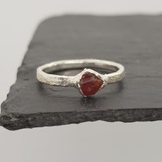 Hearts of Stars Raw Ruby Ring A natural raw uncut ruby set in uniquely textured solid silver. Also available in an oxidised silver finish and 24K gold plate. - stone: Ruby - stone size: approx. 3-5mm - metal: fine & sterling silver / 24K gold plate - handmade in Hertfordshire, UK Crystal Properties Ruby - thought to be a stone of courage, strength and joy. Ruby is the birthstone of July. ------------------------------------------------------------------ These rings are made to order - please all Electroformed Ring, Raw Ruby, July Birthstone Ring, Raw Gemstone Jewelry, Raw Gemstone Ring, Jewellery Uk, Ruby Stone, July Birthstone, Perfect Engagement Ring