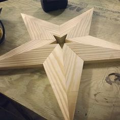 a wooden star sitting on top of a table