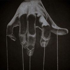 a drawing of a hand reaching out from the ground, with strings attached to it