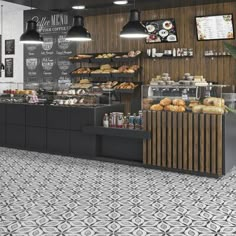 the interior of a bakery with black and white tiles