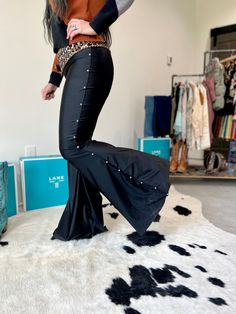 Lainey inspired Bell Bottoms Jet Black with Silver side studs 34” to 35” inseam Bell openings are 18” across the Front/Back 90% Polyester, 10% Spandex Non-see through material with amazing stretch Silverado recommends sizing down because these are made with four-way stretch fabric. Made in Texas Jamie is wearing the size Small and wears a 27 in Flying Monkey jeans. See size chart for reference on sizing. XS S M L XL US 2-4 4-6 8-10 12-14 14-16 Bust 33-34 34-36 36-38 39-40 41-42 Waist 25-26 27-28 Outfits With Black Bell Bottoms, Black Bell Bottoms Outfit Western, Black Bell Bottoms Outfit, Black Bell Bottoms, Bell Bottoms Outfit, Backyard Hammock, Wide Leg Jeans Outfit, Monkey Jeans, Flying Monkey Jeans