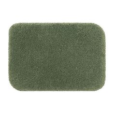 a green bath mat is shown on a white background, it looks like an area rug