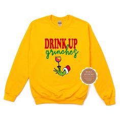 Shop our super cute Drink up Grinches Christmas Shirt today. This Grinch Christmas Shirt is sure to be a hit at your Christmas Party. This Funny Grinch Sweater is unisex and available in sizes S-4X.Get either your normal size (for a loose fit) or size down for a more fitted look.(e.g., if you are a Ladies XL, choose Unisex L)*** UNISEX FIT offers a relaxed fit that works well for men and women. Sweatshirt -50% ring-spun cotton/50% polyester; -Soft fleece inside -Mid-weight, Boyfriend/unisex fit Funny Long Sleeve Christmas Tops, Fun Winter T-shirt With Crew Neck, Cute Holiday Crew Neck Sweatshirt, Cute Crew Neck Sweatshirt For Holiday, Fun Winter Tops With Relaxed Fit, Winter Fun Relaxed Fit Tops, Funny Print Sweatshirt For Winter, Funny Print Winter Sweatshirt, Fun Crew Neck Winter Sweatshirt