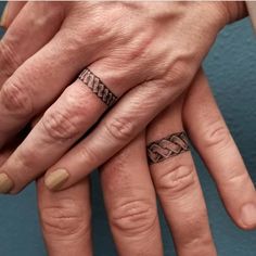 two people with wedding rings on their fingers