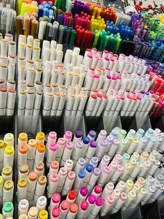 many different colored markers are on display for sale