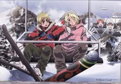 two people sitting on a ski lift in the snow