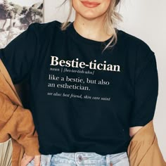 a woman wearing a black t - shirt with the words bestie - titian on it