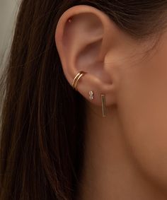 Truly perfect in any piercing location. These studs brighten your face and elevate your ears. Safe for sensitive skin, our pieces are hand crafted and made to wear 24/7. Solid 14k gold with 2 natural diamonds (.036 cw). Measures 2.5mm x 5mm. Available as a single stud or in a pair. These earrings come with our signature mini push-on butterfly backings for the most hygienic and comfortable fit. Less metal behind your ears means less build-up and more room for multiple piercings close together. Al Ear Piercing Minimalist, Hair Cuffs, Multiple Piercings, Double Diamond, Chain Anklet, Diamond Stud, White Rose Gold, White Rose, Diamond Studs