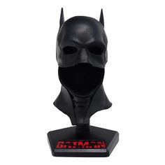 a batman mask on top of a stand