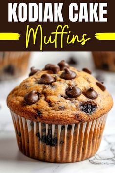 a close up of a muffin with chocolate chips on top and the words kodiak cake muffins above it