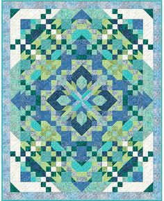 a blue and green quilt with squares on it