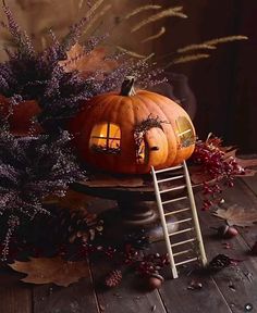 two pumpkins sitting on top of a wooden table next to a ladder with the words halloween written across it