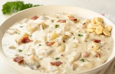 a white bowl filled with food on top of a table