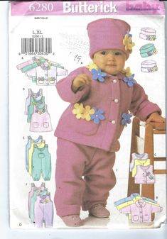 an image of a baby doll in pink outfit and pants with flowers on the chest