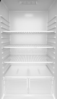 an empty white refrigerator with the door open and shelves in front of it stock images