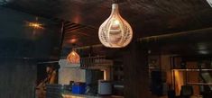 a light fixture hanging from the ceiling in a restaurant