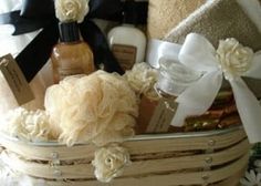 a basket filled with lots of different types of towels and soaps on top of a table