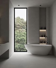 a large white bath tub sitting inside of a bathroom