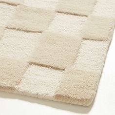 a white rug with squares on it