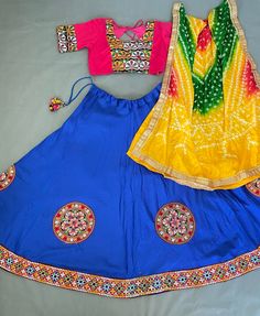 *🌷Lehenga choli🌷* *Lehenga(Stitched)* Lehenga Fabric : Cotton  Lehenga Work : Embroidered Aari Work Patches (Lace Border)  Lehenga Closer : Drawstring and tassels  Lehenga Waist : Support Up To 42  Length : 41 Flair : 4 Meter Inner : Micro Cotton *Blouse(Stitched)* Blouse Fabric : Cotton  Blouse Size:  38"( There Is a extra two inch Margin so Customer Can Adjust Upto 36 To 42) Blouse Work : Embroidered Aari Work Patches  Blouse length : 15" Sleeve Length : 20" *Dupatta* Dupatta Fabric : Leheriya Bandhej Dupatta work : Gota pati border with Tassels Dupatta Length : 2.3 Meter Actual colour may vary. While we do our best to capture colours accurately, colour might appear differently due to lighting conditions, the device on which the picture is viewed, etc. Please note that returns and exch Fitted Bollywood Lehenga With Motifs, Cotton Lehenga With Unstitched Blouse For Diwali, Fitted Multicolor Traditional Wear With Bandhani Print, Fitted Bohemian Anarkali Set With Bandhani Print, Bohemian Bandhani Print Fitted Choli, Navratri Lehenga With Multicolor Embroidery And Unstitched Blouse, Diwali Festival Lehenga With Unstitched Blouse, Festive Multicolor Lehenga With Motifs, Fitted Saree Set For Festival