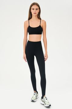 Our famous, form fitting high waist legging redesigned as a stirrup tight. Our ultra luxe Airweight fabric has a supremely soft hand and second skin comfort. BEST FOR: hot yoga, barre, Pilates. Model is 5'10" and wears a size small. Sleek Yoga Activewear With Built-in Bra, Sleek Compressive Leggings For Pilates, Sleek Yoga Tights, Full Length Seamless Tights For Pilates, Seamless Full-length Tights For Pilates, Bottoms With Smoothing Minimal Stretch For Yoga, Black Seamless Tight Activewear, Full Length Seamless Leggings For Pilates, Tight Seamless Leggings For Pilates