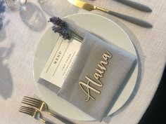 a place setting with silverware and napkins