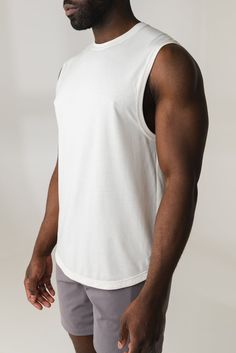 Our Adapt Tank is designed for the ultimate comfort & everyday wear while adding style to your wardrobe. This crew neck tank is a relaxed yet classic fit. Athleisure Cotton Tank T-shirt, Cotton Tank T-shirt For Athleisure, Summer Athleisure Muscle Tee With Crew Neck, White Stretch Muscle Tee Casual Style, White Stretch Crew Neck Tank Top, Relaxed Fit Gym Tops, Comfortable Relaxed Fit Gym Tops, Comfortable Relaxed Fit Tops For Gym, White Cotton Muscle Tee Athleisure